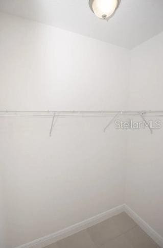 22 W Gulfstream Pl, Citrus Springs, FL 34434 - walk in closet with light tile patterned flooring