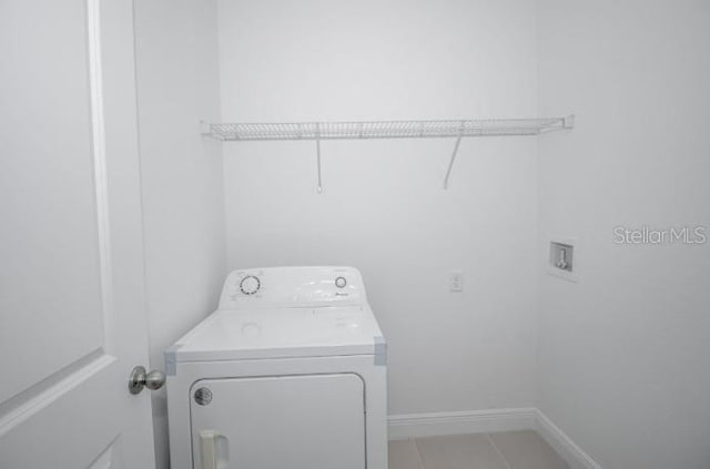 22 W Gulfstream Pl, Citrus Springs, FL 34434 - laundry area featuring washer / dryer and baseboards