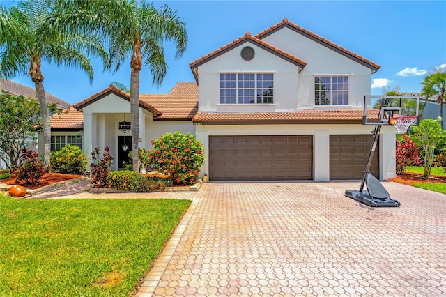 19367 NW 13th St, Pembroke Pines, FL 33029 - mediterranean / spanish-style home featuring a tile roof, stucco siding, an attached garage, decorative driveway, and a front yard