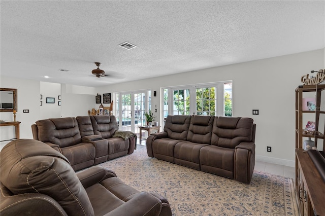 19367 NW 13th St, Pembroke Pines, FL 33029 - tiled living room featuring ceiling fan and a textured ceiling