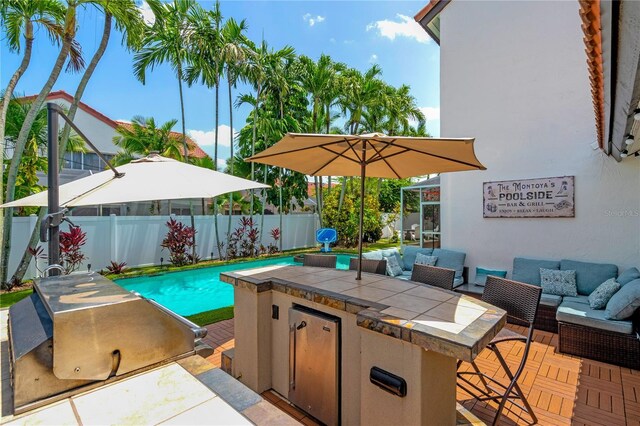 19367 NW 13th St, Pembroke Pines, FL 33029 - view of swimming pool featuring an outdoor living space, a fenced backyard, an outdoor kitchen, a bar, and a patio area