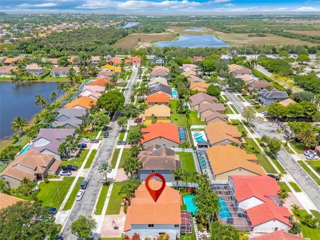 19367 NW 13th St, Pembroke Pines, FL 33029 - aerial perspective of suburban area with a large body of water