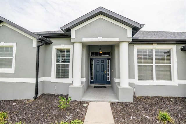 1780 Nature Cove Ln, Clermont, FL 34711 - entrance to property featuring stucco siding and a shingled roof