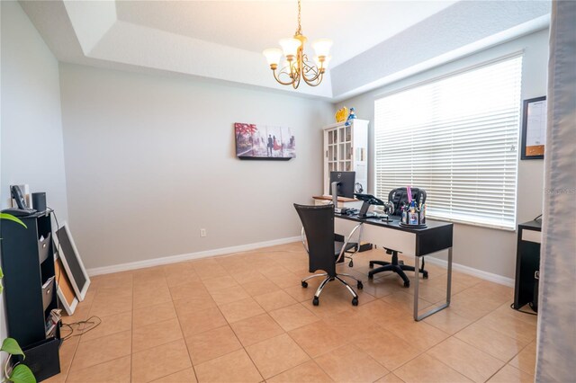 1780 Nature Cove Ln, Clermont, FL 34711 - office space featuring a chandelier, light tile patterned flooring, and a tray ceiling