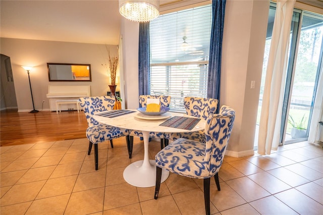1780 Nature Cove Ln, Clermont, FL 34711 - tiled dining area featuring plenty of natural light and a chandelier