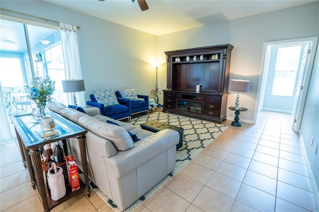 1780 Nature Cove Ln, Clermont, FL 34711 - living room with healthy amount of natural light, light tile patterned floors, and ceiling fan