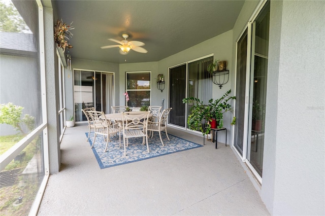 1780 Nature Cove Ln, Clermont, FL 34711 - sunroom with ceiling fan and outdoor dining area