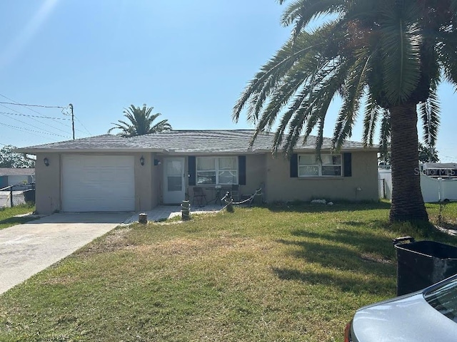 13725 Plumosa Ave, Hudson, FL 34667 - ranch-style house featuring stucco siding, an attached garage, and concrete driveway