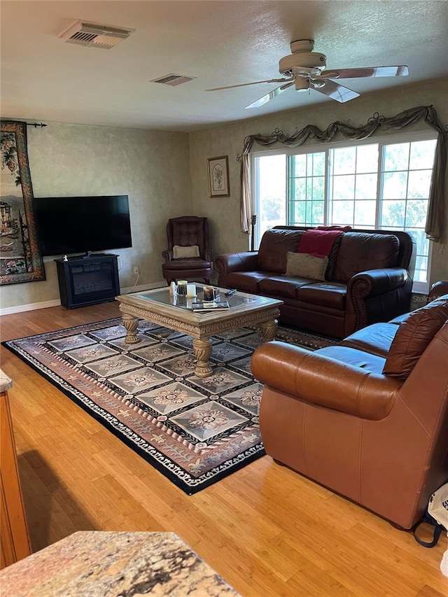 4713 9th St E, Ellenton, FL 34222 - living area featuring wood finished floors and a ceiling fan