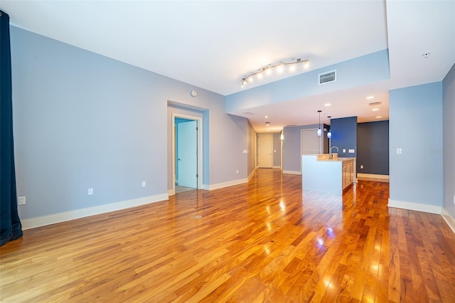 260 S Osceola Ave Unit 710, Orlando, FL 32801 - unfurnished living room featuring light wood-style flooring and baseboards