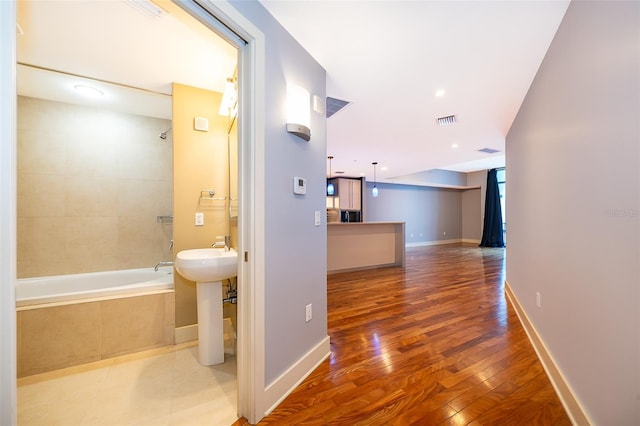 260 S Osceola Ave Unit 710, Orlando, FL 32801 - hall with wood finished floors and a sink