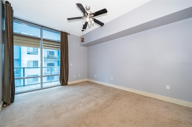 260 S Osceola Ave Unit 710, Orlando, FL 32801 - empty room featuring carpet flooring, healthy amount of natural light, and ceiling fan