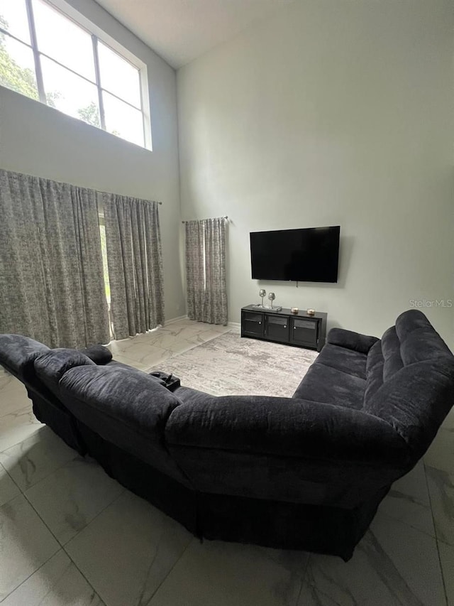 8894 Candy Palm Rd, Kissimmee, FL 34747 - living room with marble finish flooring
