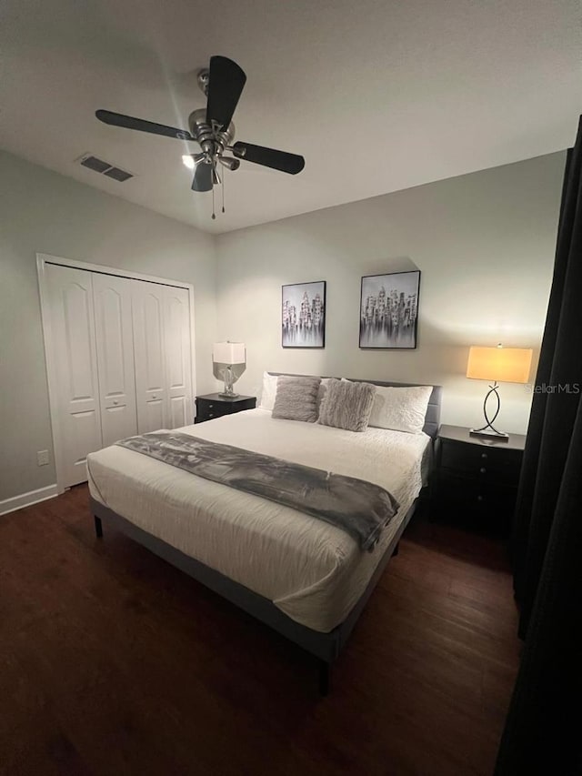 8894 Candy Palm Rd, Kissimmee, FL 34747 - bedroom with a closet, dark wood-style flooring, ceiling fan, and baseboards