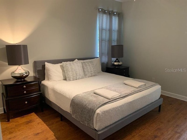 8894 Candy Palm Rd, Kissimmee, FL 34747 - bedroom featuring wood finished floors and baseboards