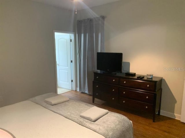 8894 Candy Palm Rd, Kissimmee, FL 34747 - bedroom featuring wood finished floors