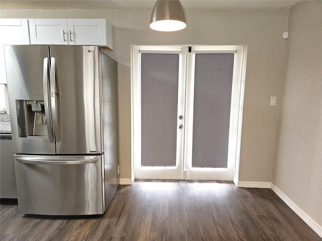 kitchen with stainless steel fridge, dark wood-style floors, baseboards, and french doors