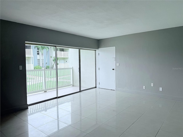 250 N Banana River Dr Unit H11, Merritt Island, FL 32952 - tiled empty room with baseboards