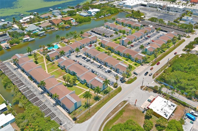 250 N Banana River Dr Unit H11, Merritt Island, FL 32952 - aerial view of property and surrounding area featuring a nearby body of water and nearby suburban area