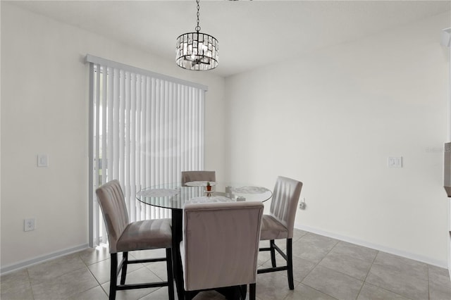 884 Laurel View Way, Groveland, FL 34736 - dining area with a chandelier, baseboards, and light tile patterned floors