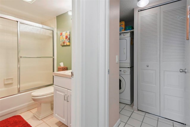 6218 Palma Del Mar Blvd S Unit 103, Saint Petersburg, FL 33715 - bathroom featuring tile patterned floors, stacked washing machine and dryer, a closet, and vanity