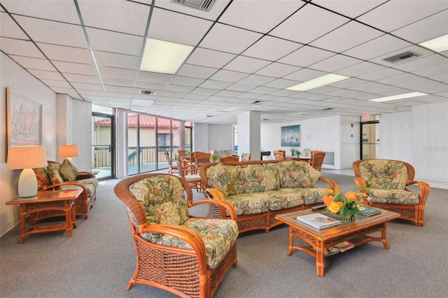 6218 Palma Del Mar Blvd S Unit 103, Saint Petersburg, FL 33715 - carpeted living area featuring a paneled ceiling and a wall of windows