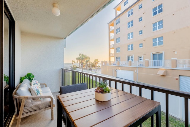 701 S Atlantic Ave Unit Ut21, New Smyrna Beach, FL 32169 - balcony at dusk featuring outdoor dining area