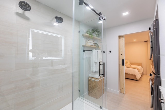 701 S Atlantic Ave Unit Ut21, New Smyrna Beach, FL 32169 - full bath featuring ensuite bathroom, a stall shower, wood finished floors, vanity, and baseboards