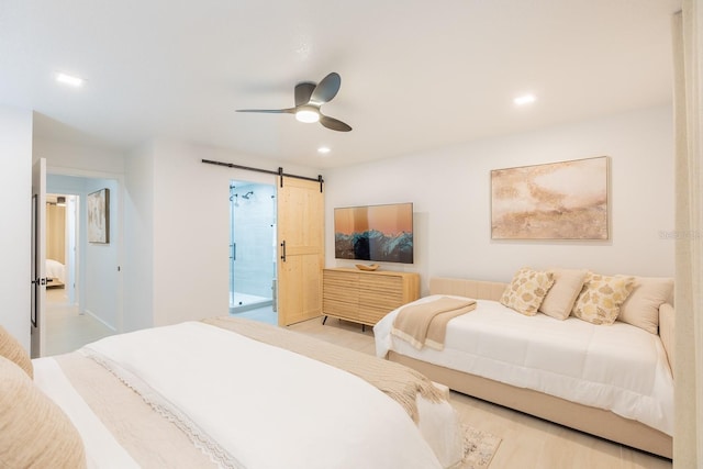 701 S Atlantic Ave Unit Ut21, New Smyrna Beach, FL 32169 - bedroom with a barn door, recessed lighting, wood finished floors, and a ceiling fan