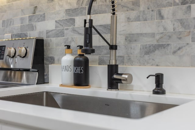 701 S Atlantic Ave Unit Ut21, New Smyrna Beach, FL 32169 - kitchen view of tasteful backsplash and a sink
