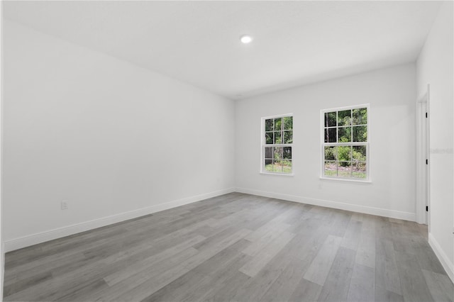 10290 N Biscayne Dr, Citrus Springs, FL 34434 - empty room with wood finished floors and recessed lighting