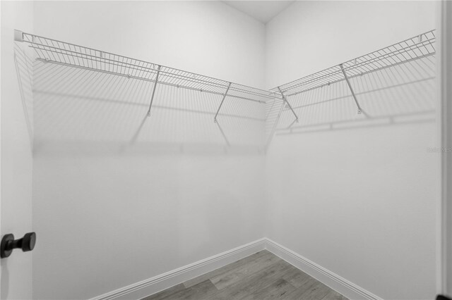 10290 N Biscayne Dr, Citrus Springs, FL 34434 - spacious closet featuring wood finished floors