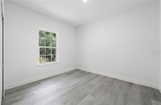 10290 N Biscayne Dr, Citrus Springs, FL 34434 - unfurnished room featuring wood finished floors and baseboards