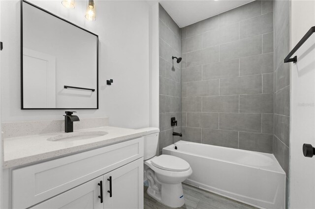10290 N Biscayne Dr, Citrus Springs, FL 34434 - bathroom with vanity, shower / tub combination, and wood finished floors
