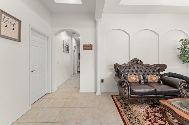 13768 Bluebird Pond Rd, Windermere, FL 34786 - living room featuring arched walkways and light tile patterned floors