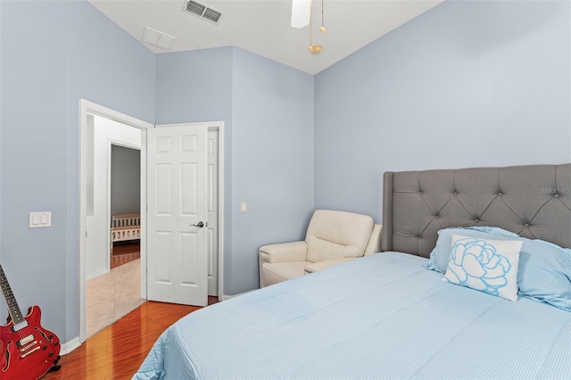 13768 Bluebird Pond Rd, Windermere, FL 34786 - bedroom featuring wood finished floors, radiator, baseboards, and a ceiling fan