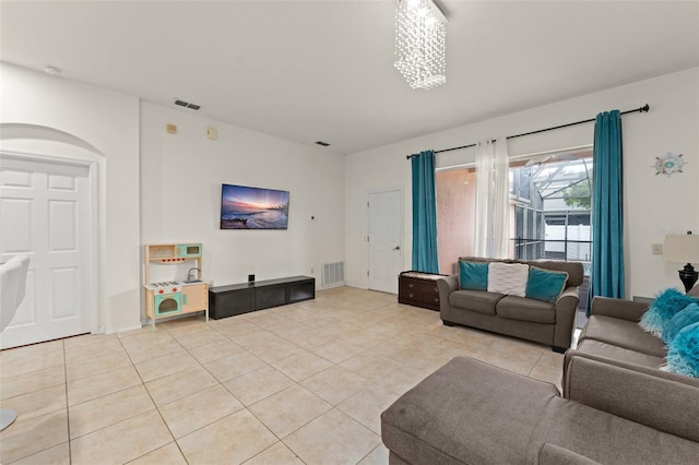 13768 Bluebird Pond Rd, Windermere, FL 34786 - living area featuring light tile patterned floors, arched walkways, and baseboards