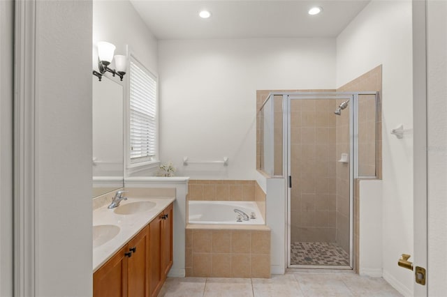 13768 Bluebird Pond Rd, Windermere, FL 34786 - full bathroom featuring a garden tub, a stall shower, double vanity, tile patterned flooring, and recessed lighting