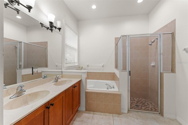 13768 Bluebird Pond Rd, Windermere, FL 34786 - full bath with a bath, a stall shower, double vanity, tile patterned flooring, and recessed lighting