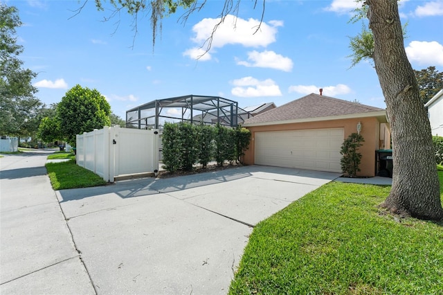 13768 Bluebird Pond Rd, Windermere, FL 34786 - view of property exterior with stucco siding, concrete driveway, roof with shingles, and a gate