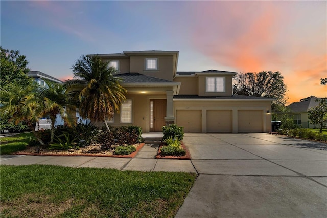 13519 Bicton Ln, Windermere, FL 34786 - view of front of house featuring a garage, stucco siding, concrete driveway, and a shingled roof