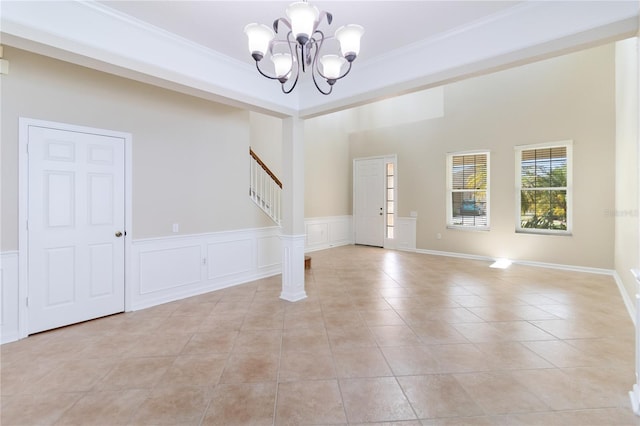 13519 Bicton Ln, Windermere, FL 34786 - unfurnished room featuring a chandelier, light tile patterned floors, stairway, and crown molding