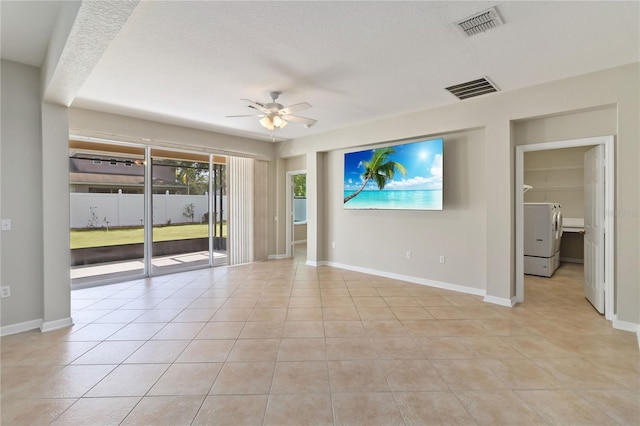 13519 Bicton Ln, Windermere, FL 34786 - spare room featuring washer / dryer, ceiling fan, and light tile patterned floors