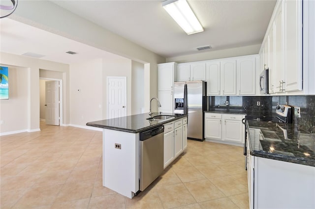 13519 Bicton Ln, Windermere, FL 34786 - kitchen featuring stainless steel appliances, white cabinets, light tile patterned floors, and backsplash