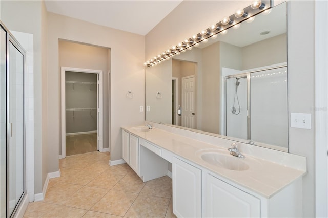 13519 Bicton Ln, Windermere, FL 34786 - full bath featuring a shower stall, double vanity, tile patterned flooring, and a walk in closet