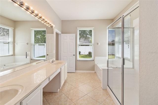 13519 Bicton Ln, Windermere, FL 34786 - full bathroom featuring double vanity, a garden tub, a shower stall, and healthy amount of natural light