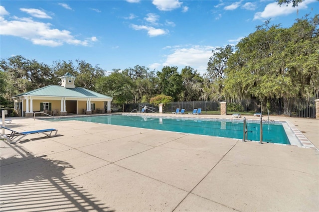 13519 Bicton Ln, Windermere, FL 34786 - community pool with a patio and view of scattered trees