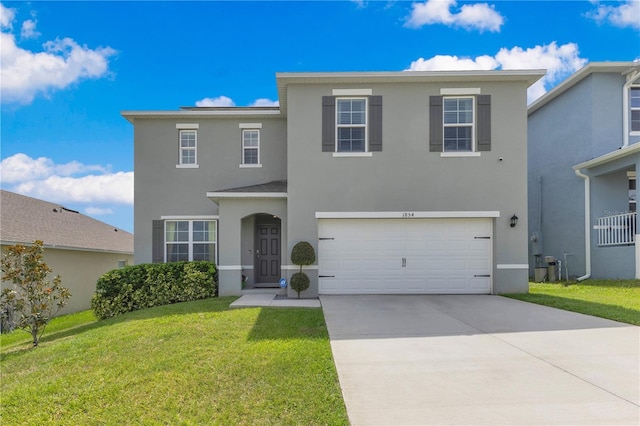 1854 Juneberry St, Clermont, FL 34715 - traditional-style home with stucco siding, an attached garage, concrete driveway, and a front yard