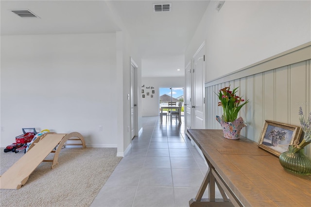 1854 Juneberry St, Clermont, FL 34715 - hall with light tile patterned flooring and light carpet