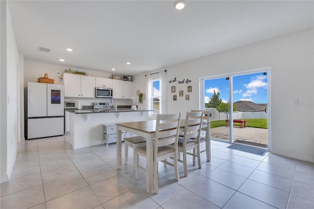 1854 Juneberry St, Clermont, FL 34715 - dining space with recessed lighting and light tile patterned floors
